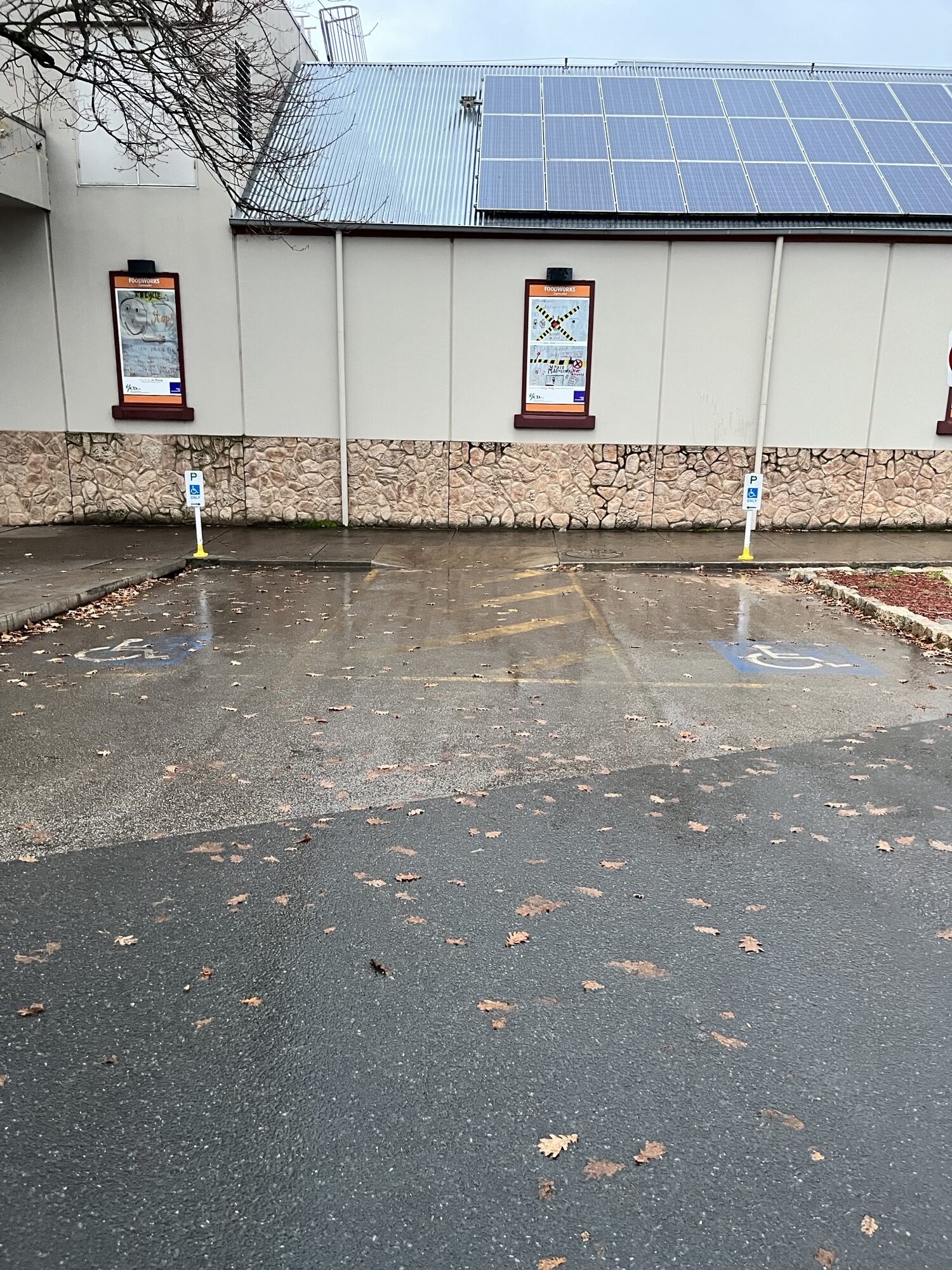 Two accessible car parks in Yackandandah IGA parking lot.